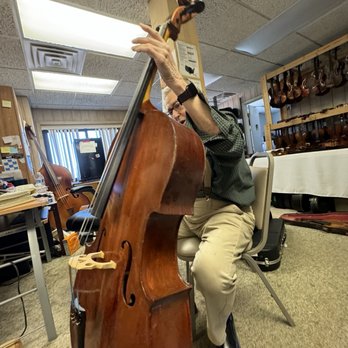 Peter Zaret and Sons Violins - Peter checking out my cello. - Musical Instruments & Teachers Near Me - Cleveland, Ohio Peter Zaret and Sons Violins - Peter checking out my cello. - Musical Instruments & Teachers Near Me - Cleveland, Ohio