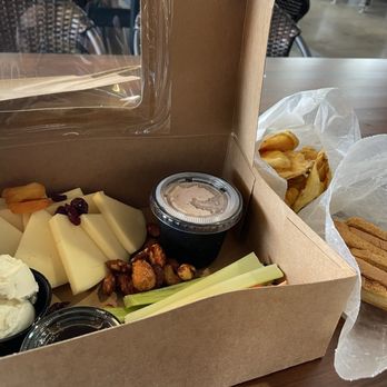 Newport Vineyards - vineyard snack box: local cheeses, solider bean hummus, summer jam, dried fruit, spiced nuts, root vegetables, house chips, and crostini - Wineries Near Me - Middletown, Rhode Island