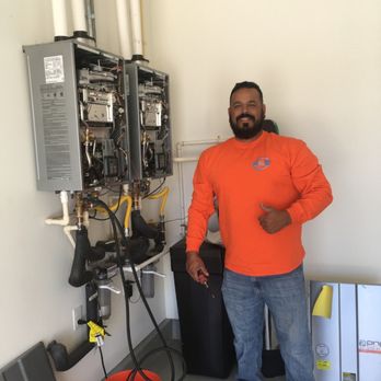 Rick Pacheco Plumbing - Working on a double tankless Rennai System - Water Heater Installation/Repair Near Me Rick Pacheco Plumbing - Working on a double tankless Rennai System - Water Heater Installation/Repair Near Me