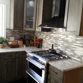 Eck and Hoch Construction, LLC - GE Cafe appliances complimented with Allen Roth granite counter and tile backsplash - General Contractors Near Me - Temple, Pennsylvania
