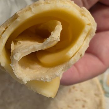 La Loma Tortilleria - A tortilla from Tortilleria La Loma with two slices of Smoked Gouda Cheese. - Bakeries Near Me - Roanoke, Virginia La Loma Tortilleria - A tortilla from Tortilleria La Loma with two slices of Smoked Gouda Cheese. - Bakeries Near Me - Roanoke, Virginia