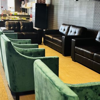 Ignited Hookah Lounge - a row of green couches - Hookah Bars Near Me - Chandler, Arizona