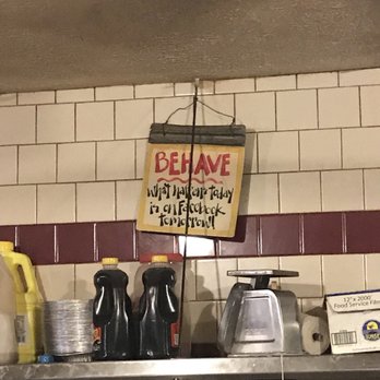 Hot Tomato’s - a sign on a shelf in a kitchen - Pizza Near Me - Baltimore, Maryland Hot Tomato’s - a sign on a shelf in a kitchen - Pizza Near Me - Baltimore, Maryland