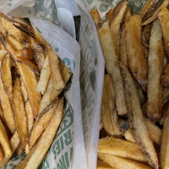 Wingstop - two baskets of french fries and a sandwich - Chicken Wings Near Me - Elgin, Illinois