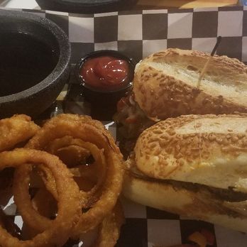 Bulldog Saloon - Dirty Harry french dip with onion rings added. Great sandwich, lots of veg and cheese in with the steak (yes, steak) - Pubs Near Me - Lynnwood, Washington Bulldog Saloon - Dirty Harry french dip with onion rings added. Great sandwich, lots of veg and cheese in with the steak (yes, steak) - Pubs Near Me - Lynnwood, Washington