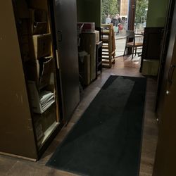 Spumoni Italian Cafe & Pizzeria - Hallway from the restroom to the right restaurant... Doubles as a Storage area