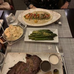 Slow roasted prime rib, sea scallops and shrimp dish. Cauliflower casserole and asparagus. Slow roasted prime rib, sea scallops and shrimp dish. Cauliflower casserole and asparagus.