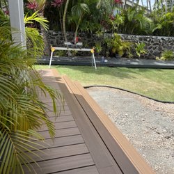 Trex deck (picture frame finish) forest brown  in the background the walkway was done in clam shell