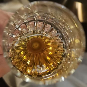 WeVINO - Louis XIII Cognac in an official Baccarat Crystal glass showing a dazzling sunflower pattern - Wine Bars Near Me - Westlake Village, California WeVINO - Louis XIII Cognac in an official Baccarat Crystal glass showing a dazzling sunflower pattern - Wine Bars Near Me - Westlake Village, California