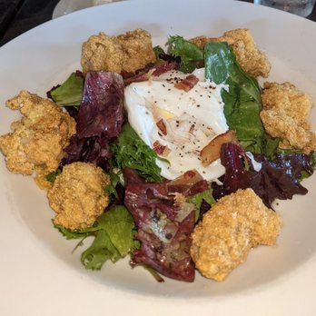 Bistro V - Fried oyster salad with poached egg, bacon and spring greens with sherry vinaigrette. - New American Near Me - Vestavia Hills, Alabama Bistro V - Fried oyster salad with poached egg, bacon and spring greens with sherry vinaigrette. - New American Near Me - Vestavia Hills, Alabama