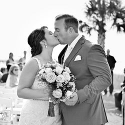 A Charmed Life Photography - Bride and Groom kissing during wedding ceremony in Myrtle Beach South Carolina by A Charmed Life Photography