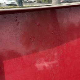 red paint on a window sill red paint on a window sill
