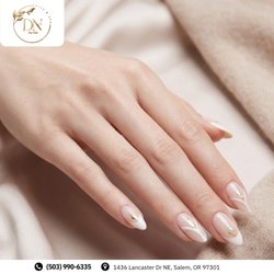 Dip Nails - Minimalist modern French! Almond nails feature clean white chevron tips, sheer nude bases, gold foil flecks, and pearl gems. Book!