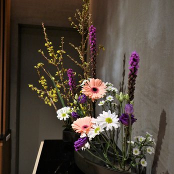 Nakaji - a vase of flowers on a table - Sushi Bars Near Me - New York, New York Nakaji - a vase of flowers on a table - Sushi Bars Near Me - New York, New York
