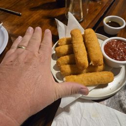 My hand for reference. The mozarella sticks are huge My hand for reference. The mozarella sticks are huge