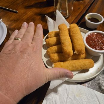Ochento's Pizza - My hand for reference. The mozarella sticks are huge - Pizza Near Me - Ensenada, BCN