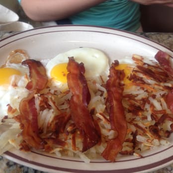 Madison Restaurant - Three eggs sunny side up with bacon and home fries - American Near Me - New York, New York Madison Restaurant - Three eggs sunny side up with bacon and home fries - American Near Me - New York, New York