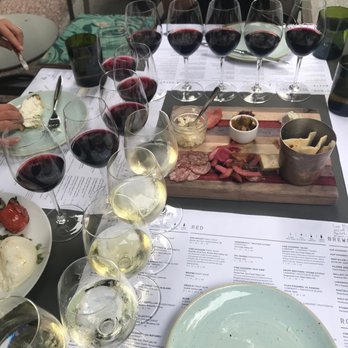 Sixty Vines - a table full of wine flights - New American Near Me - Dallas, Texas Sixty Vines - a table full of wine flights - New American Near Me - Dallas, Texas