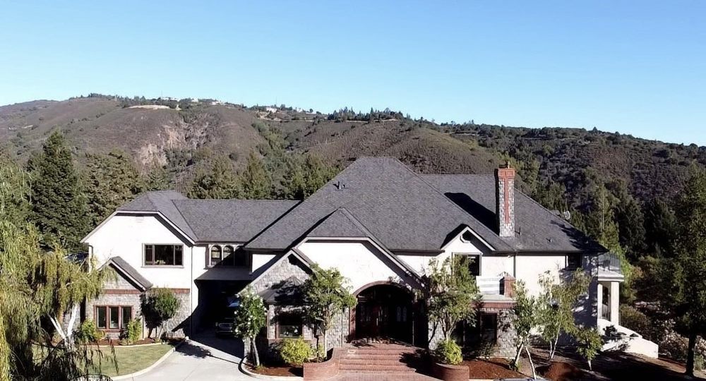 Slide of Exclusively Roofing