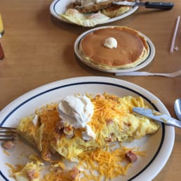 Country omelette with side of pancakes. Country fried steak in the back. Both very good selections!