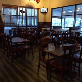 Dragon Hill - the inside of a restaurant with tables and chairs - Chinese Near Me - Clearfield, Utah