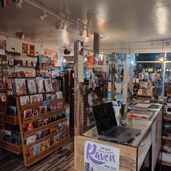 Outsider Comics And Geek Boutique - Photo of interior of outsider comics, from the back.