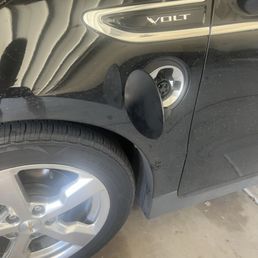 Electric charging port cover I found and fixed myself after they broke it