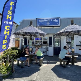 Nautical Cafe - Exterior with seating area. Right off main road, connected to a laundromat. - Sandwiches Near Me - Melbourne Beach, Florida