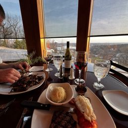 Ribeye with caramelized onions and mushrooms, filet mignon and lobster tail. Argyle Pinot noir wine Ribeye with caramelized onions and mushrooms, filet mignon and lobster tail. Argyle Pinot noir wine