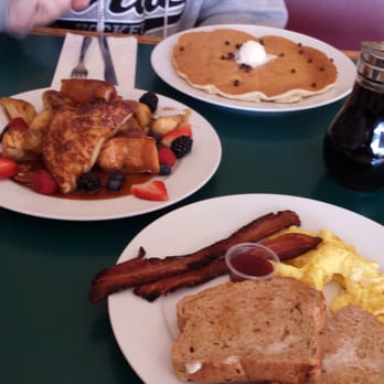 Berry Sweet Kitchen - Eggs, bacon, toast in the foreground, banana berry french toast, then chocolate chip-banana cake in the back. - Cafes Near Me - Minneapolis, Minnesota