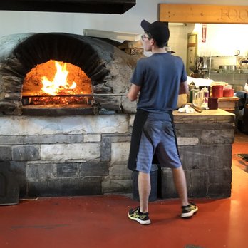 American Flatbread - Cooking the pizza - Pizza Near Me - Middlebury, Vermont
