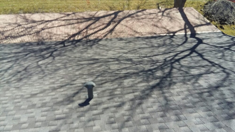 Slide of Tim's Roofing