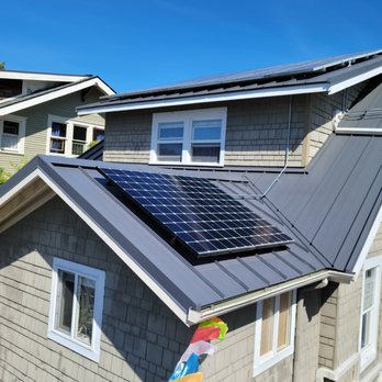 Puget Sound Solar - New solar panels mounted on frames which clip directly to the metal roof - no roof penetration. - Solar Installation Near Me - Seattle, Washington Puget Sound Solar - New solar panels mounted on frames which clip directly to the metal roof - no roof penetration. - Solar Installation Near Me - Seattle, Washington