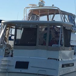 Charley’s Marine Canvas & Upholstery - Fly Bridge and Patio Enclosures with zippered windows and Sunshade bug screens