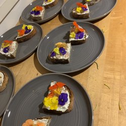 Chef Eliot Ramirez - Herb ricotta, pickled onions, nasturtium flower on burnt sourdough