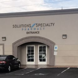 Solutions Specialty Pharmacy - Entrance, which is on the side opposite of Eastern. (So...in the back)