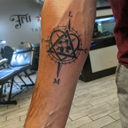 Tru Blu Tattoo - Nautical compass intertwined with the symbol for adoption and my wife and kid's initials. Exactly what I wanted.