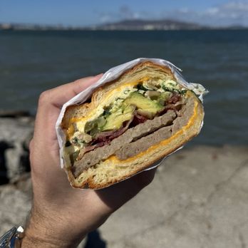 Gigi's Cafe - Inside the sausage breakfast sandwich on croissant. Massive portion, extremely fresh & tasty. Added bacon and avocado. $16.99. - Breakfast & Brunch Near Me - Burlingame, California