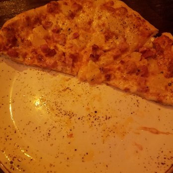 Bar Meets Grill - 1/2 of our ham & pineapple pizza - New American Near Me - Pala, California Bar Meets Grill - 1/2 of our ham & pineapple pizza - New American Near Me - Pala, California