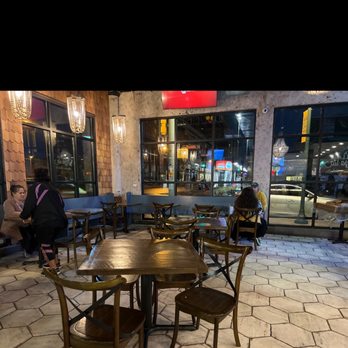 The Village Pizzeria - tables and chairs - Pizza Near Me - Waco, Texas The Village Pizzeria - tables and chairs - Pizza Near Me - Waco, Texas