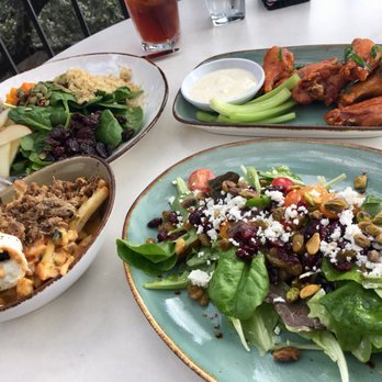 Knotty Deck Kitchen & Bar - Knotty fries with smoked brisket, wings, and 2 seasonal salads - Bars Near Me - Austin, Texas Knotty Deck Kitchen & Bar - Knotty fries with smoked brisket, wings, and 2 seasonal salads - Bars Near Me - Austin, Texas