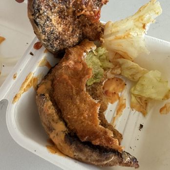 Life & Time: Free Range Fast Food - a person picking up a piece of fried chicken - Fast Food Near Me - Bend, Oregon Life & Time: Free Range Fast Food - a person picking up a piece of fried chicken - Fast Food Near Me - Bend, Oregon