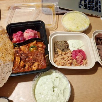 GIHON Ethiopian Kitchen - Chicken tibs (with awaze), vegan platter (cold dishes) and extra order of aukri dip below. - Ethiopian Near Me - San Diego, California