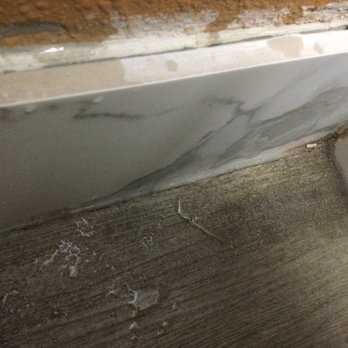 Quality Inn - Dirt and dog hair in one corner in the bathroom - Hotels Near Me - Corinth, Mississippi