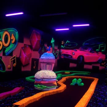 Putz n Glo Black Light Mini Golf - 18 holes of Mini Golf that will ROCK you! - Mini Golf Near Me - Rapid City, South Dakota Putz n Glo Black Light Mini Golf - 18 holes of Mini Golf that will ROCK you! - Mini Golf Near Me - Rapid City, South Dakota