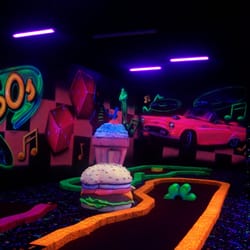 Putz n Glo Black Light Mini Golf - 18 holes of Mini Golf that will ROCK you!