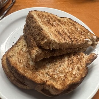 Rise N Shine Cafe - Buttery wheat toast . They have 4 different jelly choices . - Breakfast & Brunch Near Me - Los Angeles, California