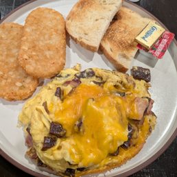 Meat omelette (your style) hash brown patties and sour dough toast.