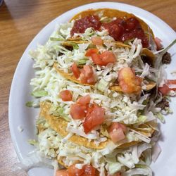 El Tapatio - 4 crunchy beef tacos, took the picture after I had already added salsa to one. You can see how fresh and tasty these are..!!