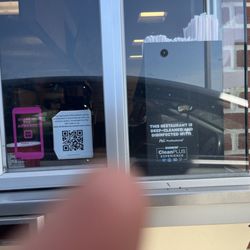 Dunkin' Donuts - It says it's cleaned with a deep cleaning disinfectant. Meanwhile, the window is disgusting and has liquid  dripping down the glass